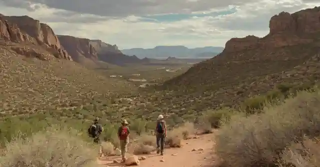 An artist depicting the breathtaking view from Apache Wash Trail with hikers in the background.
