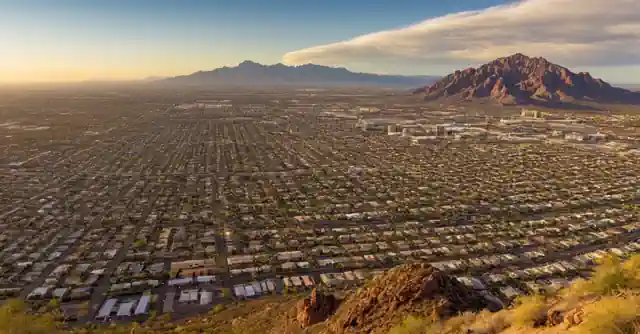 A comparison chart highlighting the cost of living, climate variations and population differences between Phoenix and Tucson.