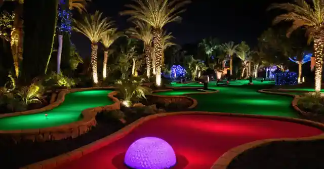 A display highlighting discounts and special offers at Scottsdales Glow Putt Mini Golf.