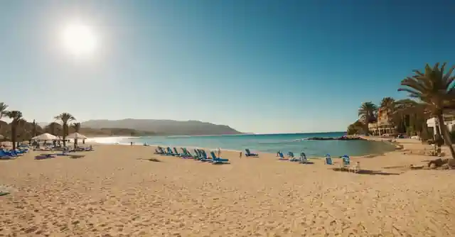 A sunny beach at Resort Los Torres with various activities and services listed.
