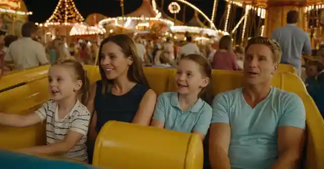 A family enjoys various affordable activities listed on the Kids Empire amusement parks activity price chart.