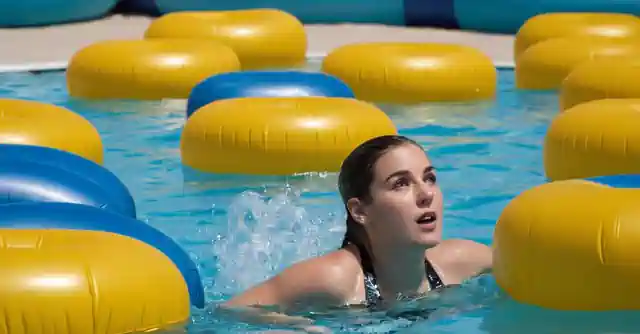 A person looking at the water parks brochure with snack bars and activity prices listed.
