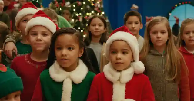 A group of children enjoying holiday events at McCormCamp Christmas Theme Park.