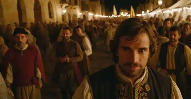 An enthusiastic individual at a bustling Spanish Medieval festival amid jesters and knights.