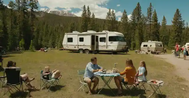 Family enjoying various activities near an RV park in the wilderness.