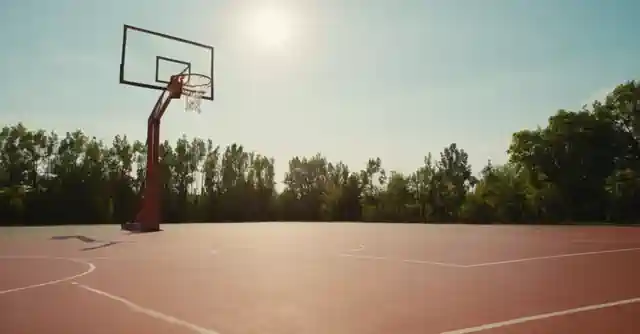 An outline of a high-quality basketball court with energetic players and sunny weather icon.