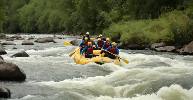 People enjoying white water rafting on the Salto River with Mild2Wild, an expert guide explaining thrilling and safe adventures.