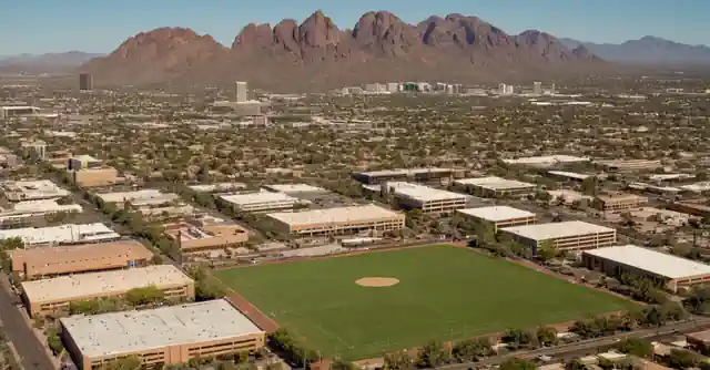 Parent researching schools with rankings chart in the cityscape of Phoenix.