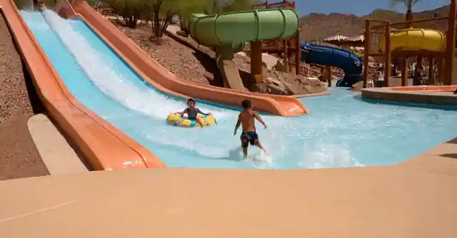 A visitor sliding down waterslides in Arizonas top splash pads at Tucson waterparks.