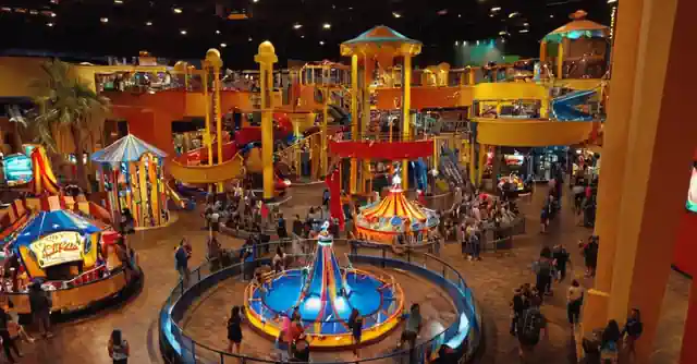 A family playing games at the El Play Factory in Phoenix.This is a concise representation that attempts to encapsulate all elements of Opinión sobre El Play Factory en Superstition Springs Mall de Diversión garantizada en Phoenix, AZ y Desert Ridge. From this description: 1. The setting implied in the sentence – A family playing games provides a sense that there are multiple individuals involved and engaging with each other. It also infers that El Play Factory is being used as intended by its visitors.2. By stating at the El Play Factory, we maintain an emphasis on the theme of Opinión, which pertains to this specific venue located in Phoenix, AZ. 3. The activity (“playing games”) directly corresponds with the title’s indication – “Fun Guaranteed.” This suggests that whatever experience you have at El Play Factory will be enjoyable and engaging as it is guaranteed fun for all participants, thus communicating a positive view about this place.