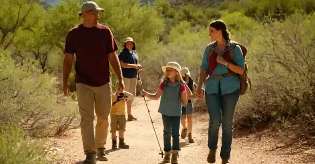 A family enjoying outdoor activities like hiking and fishing in the scenic areas of Cochise County, Arizona.