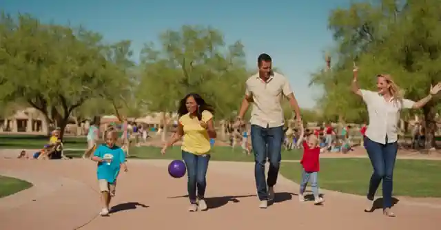 An image depicting a family having fun at a park in Goodyear, Arizona with children participating in various activities.