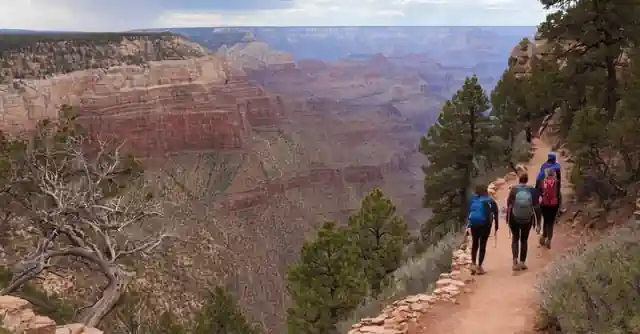 Tourists hiking on easy trails with varying difficulty levels and enjops around the breathtaking scenery of North Rim Grand Canyon.