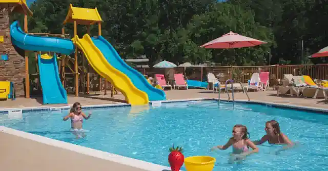 Poolside fun at the Strawberry Inn Family Pool with slides and games.