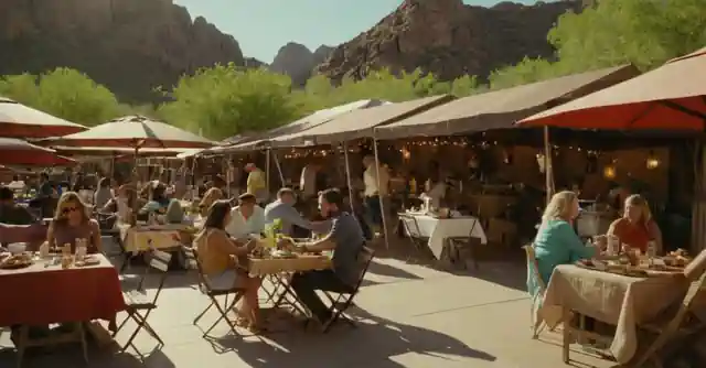 Family enjoying outdoor dining under the sun with vibrant food stalls around them in Cave Creek.
