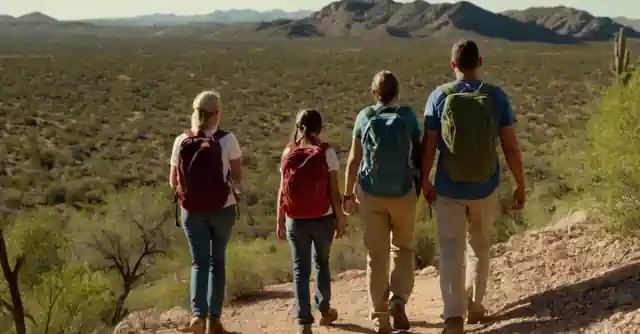 Family hiking on Santa Maria Mountains in Wickenburg.